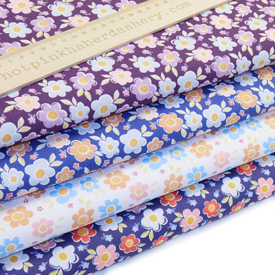 Fun and bold, retro flower printed polycotton fabric in White, Royal Blue, Navy & Purple