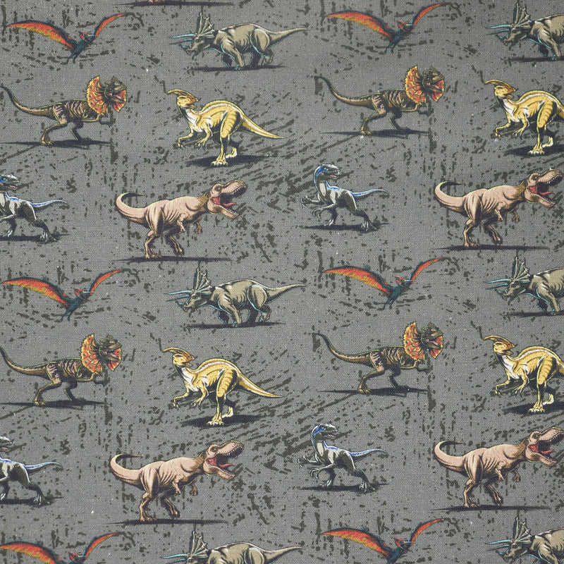 Swatch of Jurassic Park Universal Studios grey dinosaur 100% cotton fabric by Chatham Glyn