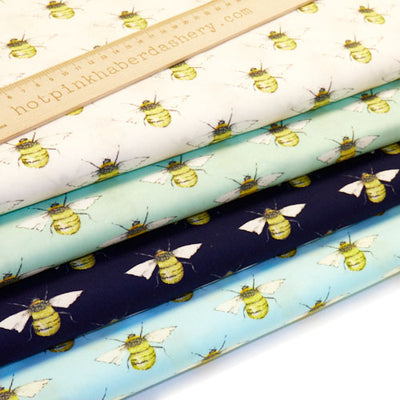 Detailed bumble bee printed 100% cotton poplin fabric by Rose and Hubble in Ivory, Meadow, Sky Blue & Navy
