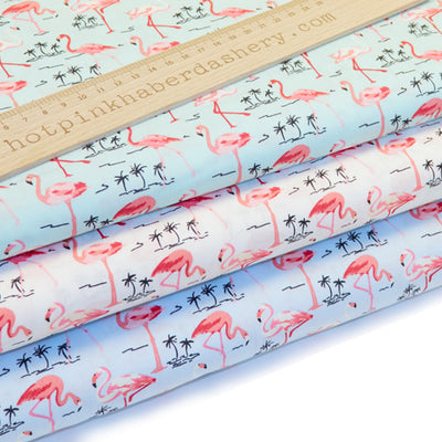 Exotic flamingo and palm tree printed 100% cotton poplin fabric by Rose and Hubble in blue, green and ivory