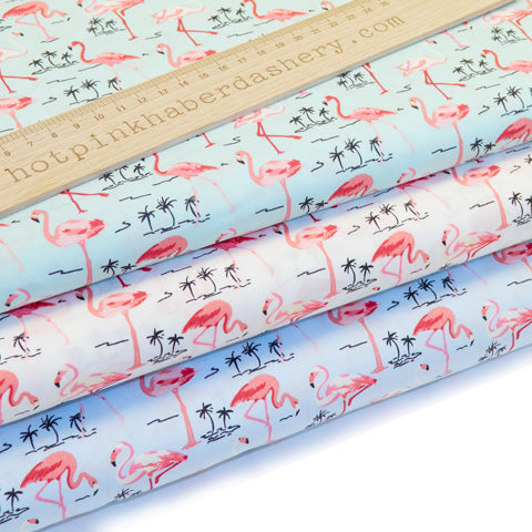 Exotic flamingo and palm tree printed 100% cotton poplin fabric by Rose and Hubble in blue, green and ivory
