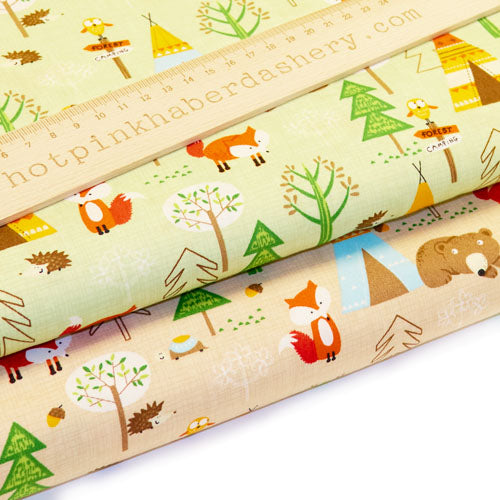 Fox and bear forest camp print with trees, hedgehogs, tepees, acorns, owls and tortoises on 100% cotton poplin fabric by Rose and Hubble in Autumn and Summer/ green or brown