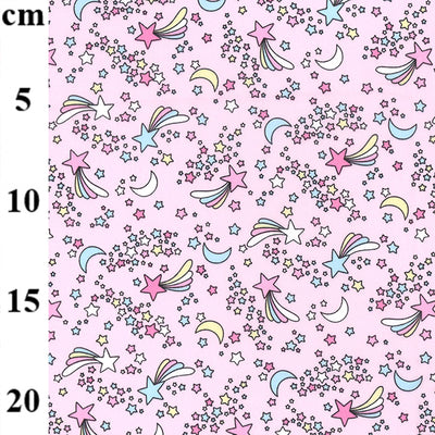 Swatch of shooting stars and moon print cute and magical children's 100% cotton poplin Rose and Hubble Fabric in pink