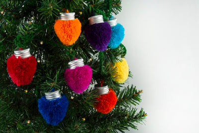 Christmas pom pom galrand making kit - christmas lights hanging on tree
