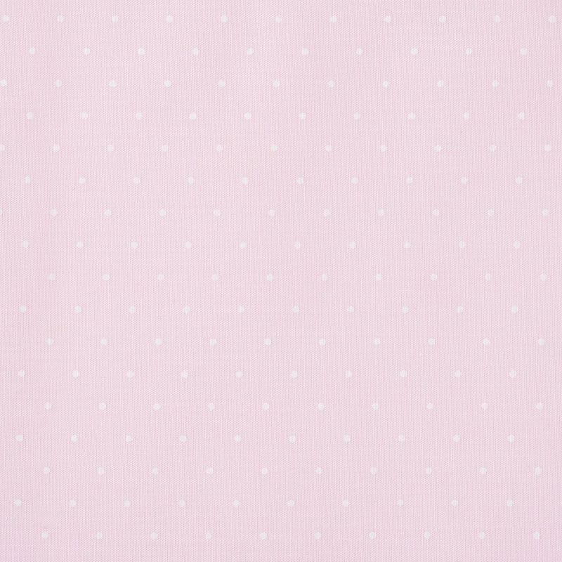 Swatch of small classic polka dot printed polycotton fabric in pastels in pink