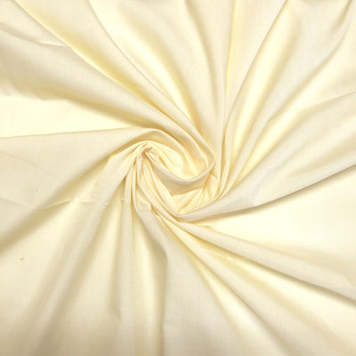 Plain polycotton fabric swatch in buttermilk 28