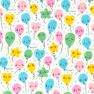 Swatch of smiley balloons polycotton fabric