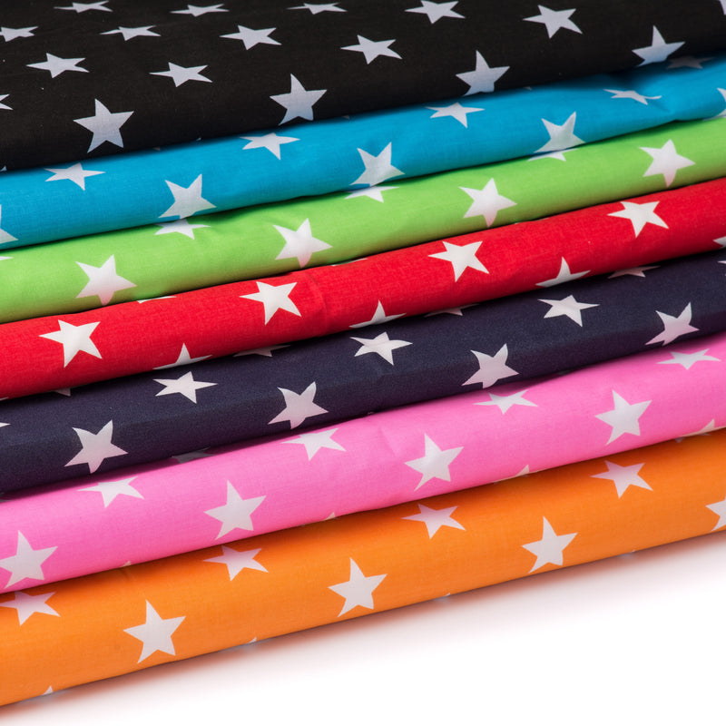 Fun and bold white stars on polycotton fabric in red, sky blue, pink, green, navy, black, orange, royal blue