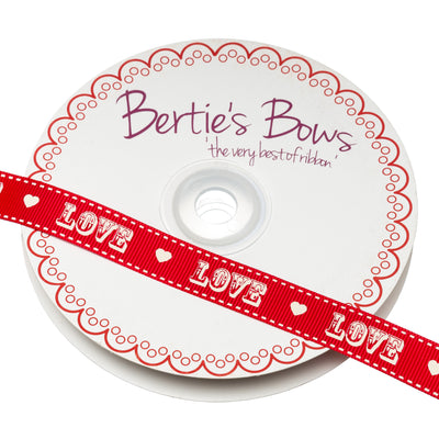 Bertie's Bows grosgrain ribbon in red with white printed 'Love' design.