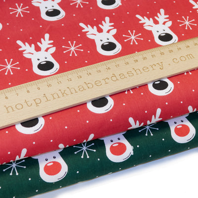 Red and green reindeer faces polycotton Christmas fabric