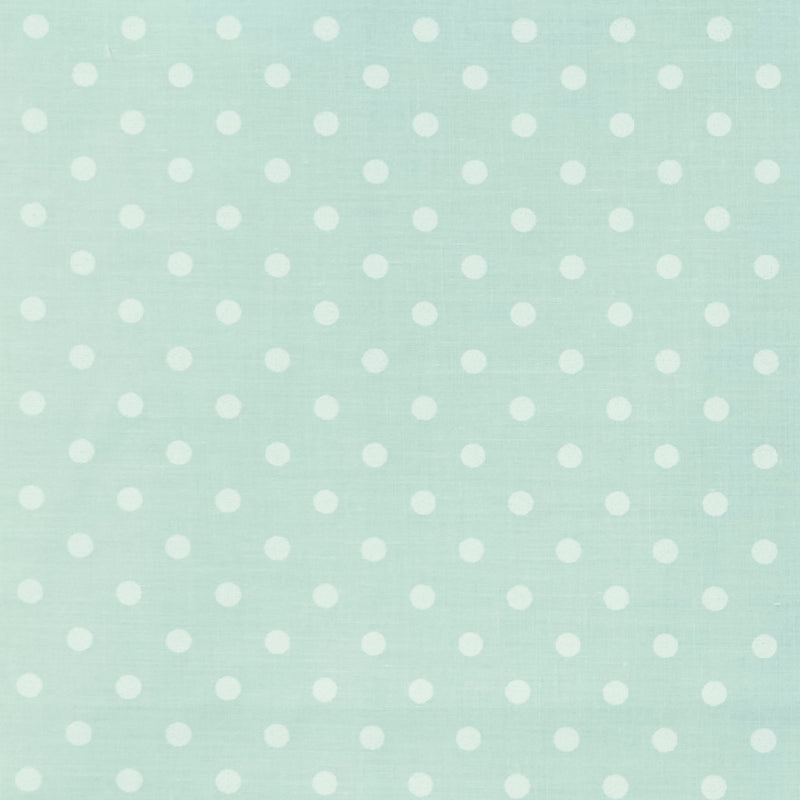 Swatch of classic pastel polka dot printed polycotton fabric in mint green