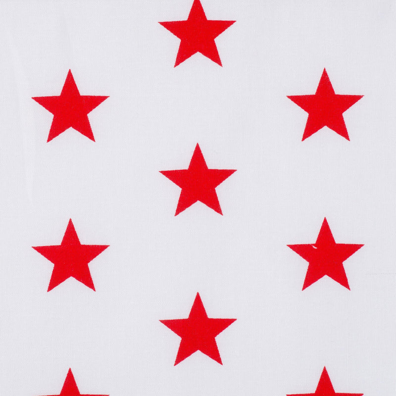 Swatch of bright and fun bold star motif polycotton fabric on white with red