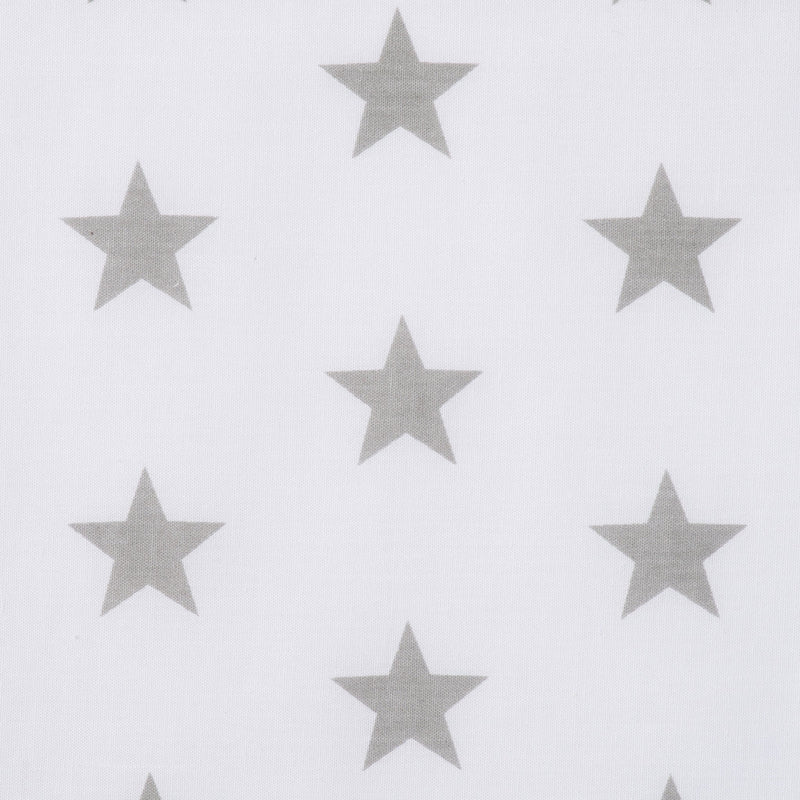 Swatch of bright and fun bold star motif polycotton fabric on white with silver