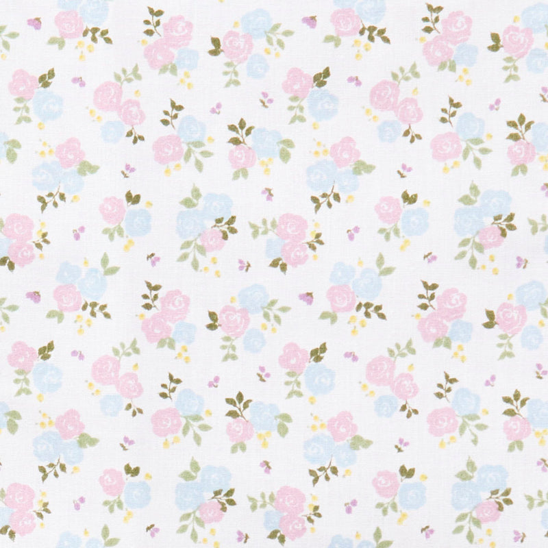 Swatch of pretty rose bouquets and leaves printed polycotton fabric in white and blue