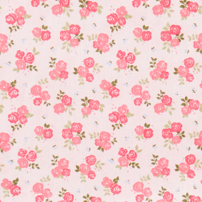 Swatch of pretty rose bouquets and leaves printed polycotton fabric in pink and white