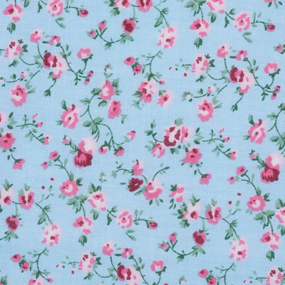 Swatch of vintage floral illustrated, country style, polycotton fabric in blue and pink
