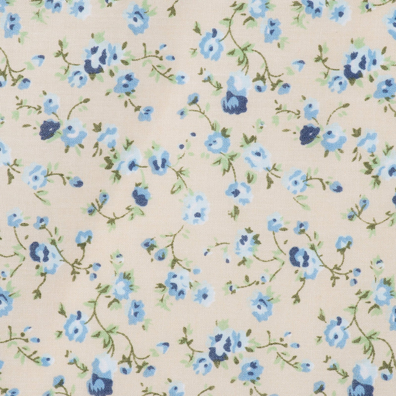 Swatch of vintage floral illustrated, country style, polycotton fabric in cream and blue