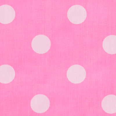 Swatch of large 50's style retro spots on polycotton fabric in pink