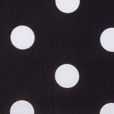 Swatch of large 50's style retro spots on polycotton fabric in black