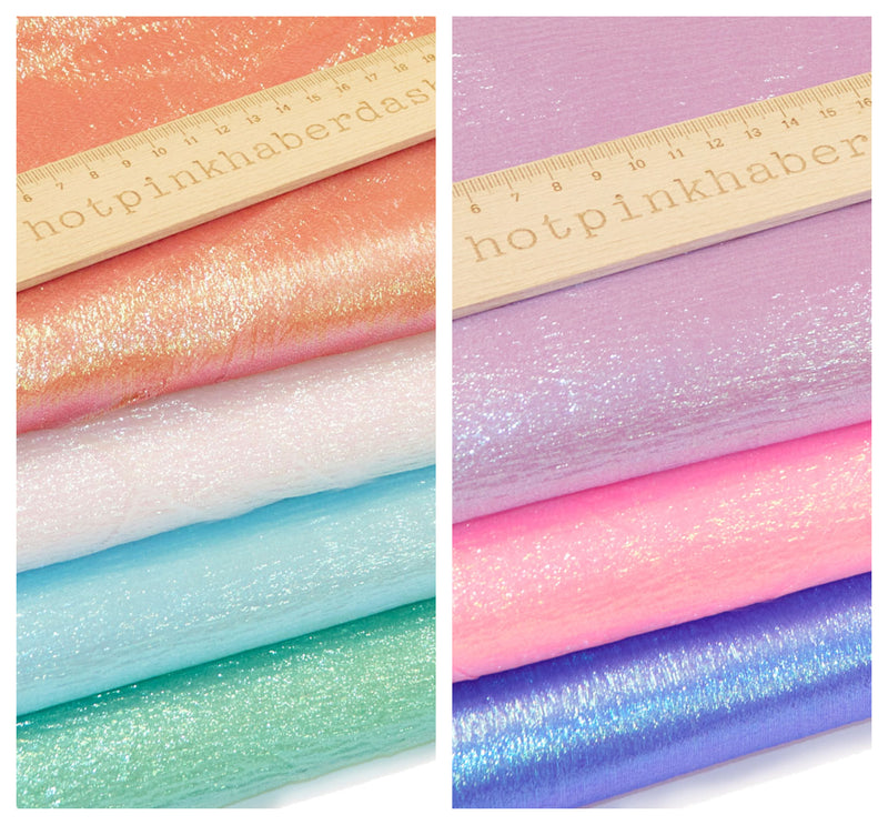 Shimmering, pearlescent rainbow 100% polyester organza fabric in Emerald, Florescent Pink, Pearl, Purple, Red, Royal Blue & Turquoise.