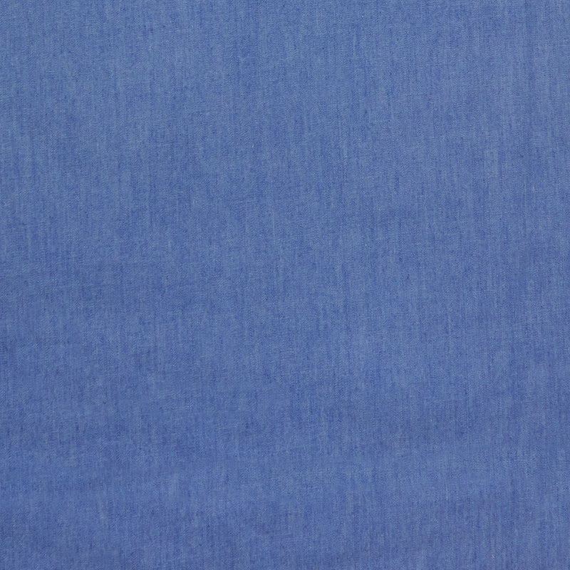 Swatch of washed 100% cotton denim fabric 4oz light weight in mid blue