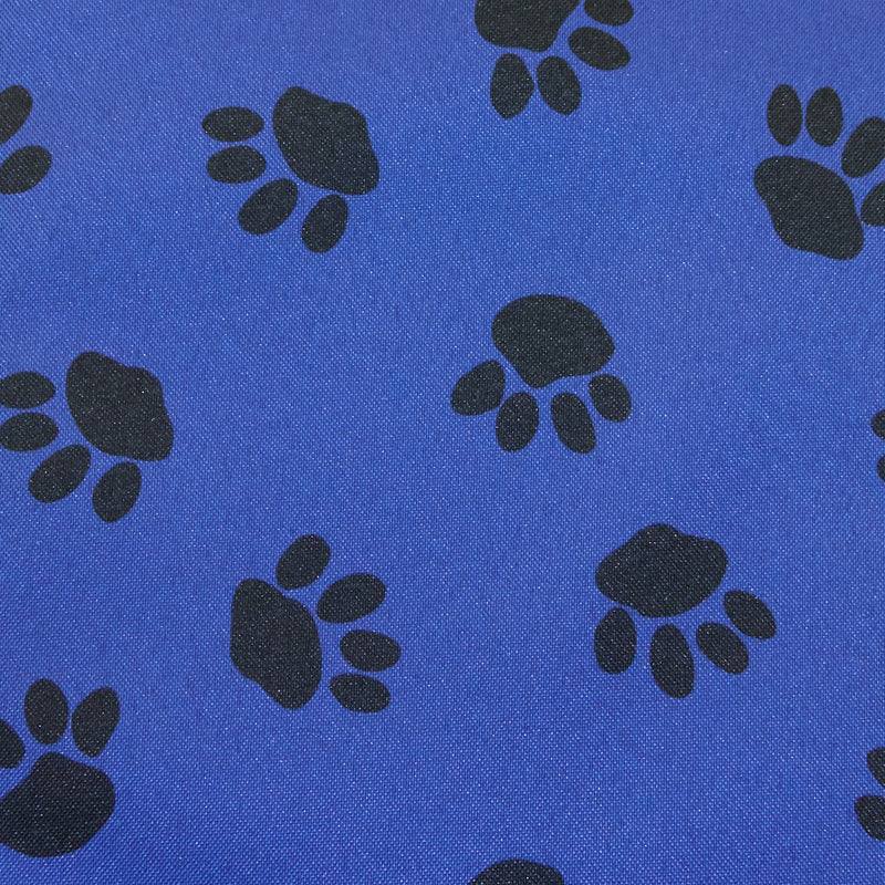 Swatch of outdoor waterproof PU 100% polyester fabric in paw pet dog print in blue