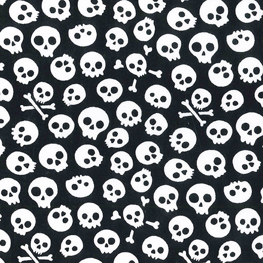 Swatch of spooky skulls Halloween print polycotton fabric in black and white