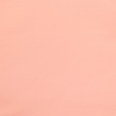 Swatch of yarn dyed stretch denim fabric in pink