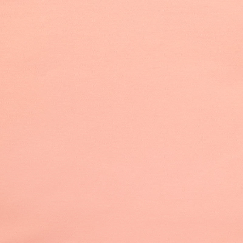 Swatch of yarn dyed stretch denim fabric in pink