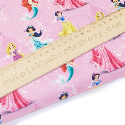 Disney Princess fabric in 100% cotton fabric by Chatham Glyn in pink
