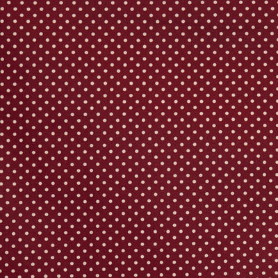 Swatch of pretty polka dot print 100% cotton poplin fabric by Rose and Hubble in burgundy red
