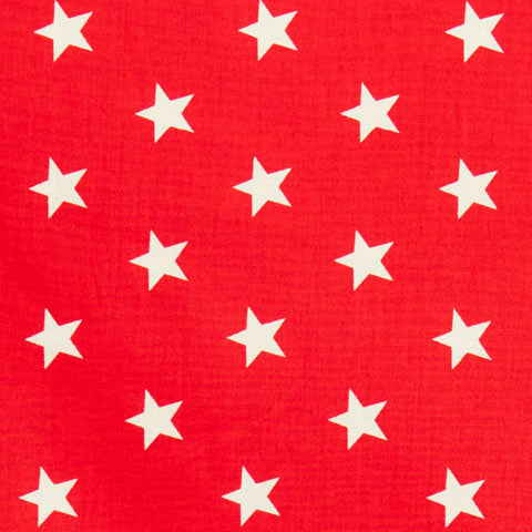 Swatch of brilliant, bold star printed 100% cotton poplin fabric by Rose and Hubble in red