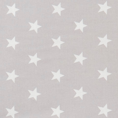 Swatch of brilliant, bold star printed 100% cotton poplin fabric by Rose and Hubble in silver