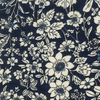 Swatch of secret garden floral print with white wild flowers and leaves 100% cotton poplin Rose and Hubble fabric in Navy Blue