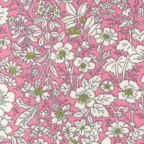 Swatch of secret garden floral print with white wild flowers and leaves 100% cotton poplin Rose and Hubble fabric in Pink