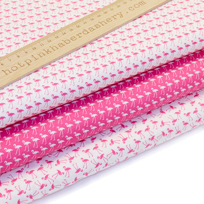 Playful dancing mini flamingo print 100% cotton poplin fabric by Rose and Hubble in cerise pink and white