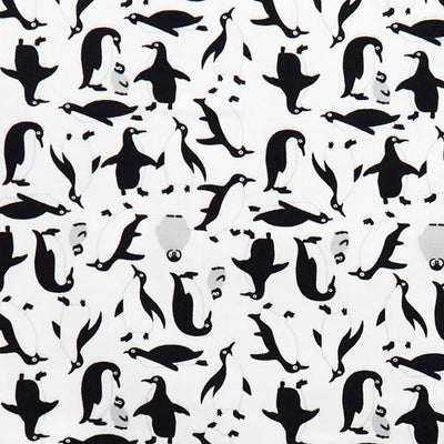 Swatch of fun penguin printed 100% cotton poplin fabric by Rose and Hubble in white