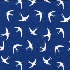 Swatch of bold white flying swallow birds print in 100% cotton poplin by Rose and Hubble in Royal blue