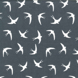 Swatch of bold white flying swallow birds print in 100% cotton poplin by Rose and Hubble in Silver Grey