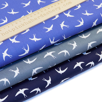 Bold white flying swallow birds print in 100% cotton poplin by Rose and Hubble in Silver Grey, Navy & Royal