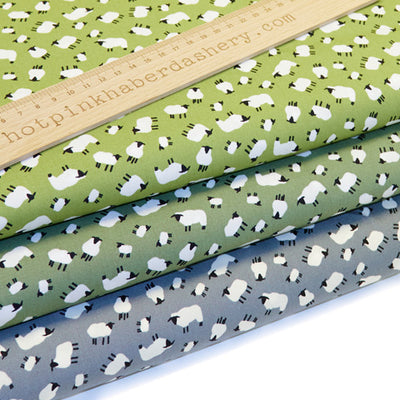 Playful sheep print 100% cotton poplin fabric by Rose and Hubble on sage, green and silver