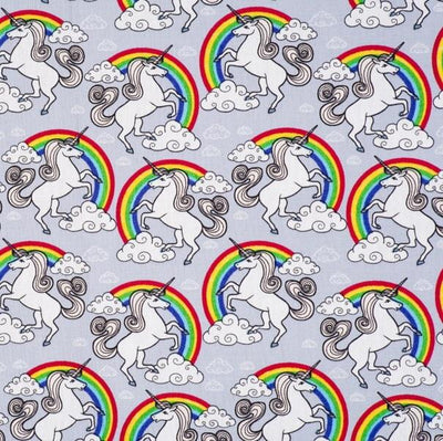 Swatch of magical, unicorns and rainbows with clouds on 100% cotton poplin fabric by Rose and Hubble in silver