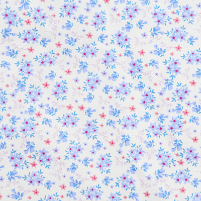 Swatch of 100% cotton poplin fabric by Rose and Hubble with star flower bouquets, leaves and buds in Blue.