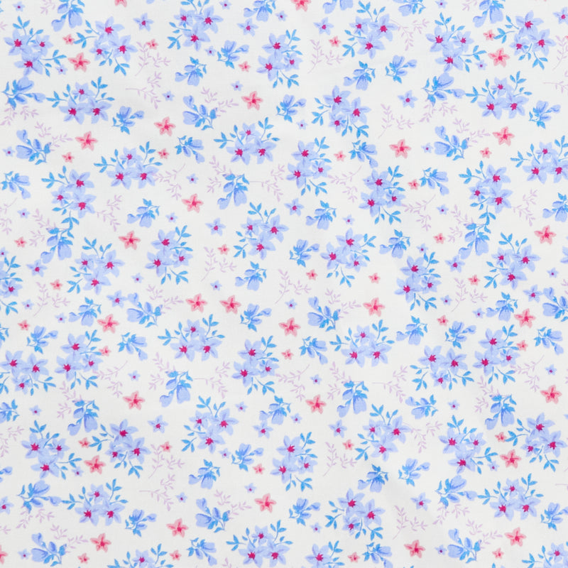 Swatch of 100% cotton poplin fabric by Rose and Hubble with star flower bouquets, leaves and buds in Blue.