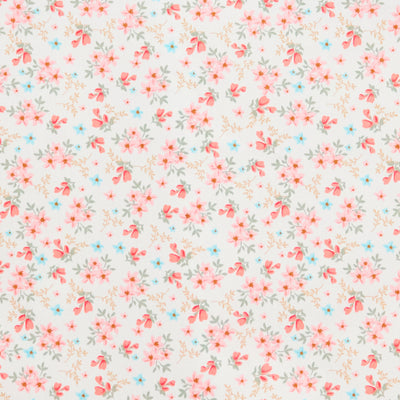 Swatch of 100% cotton poplin fabric by Rose and Hubble with star flower bouquets, leaves and buds in Coral