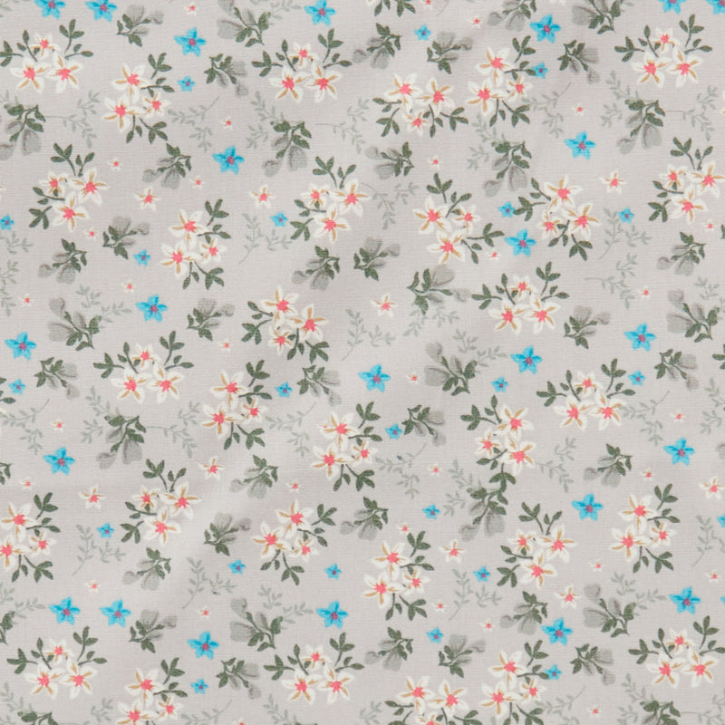 Swatch of 100% cotton poplin fabric by Rose and Hubble with star flower bouquets, leaves and buds in Grey