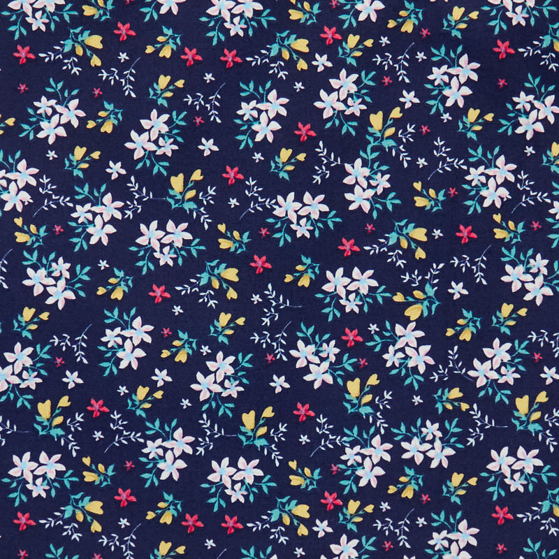 Swatch of 100% cotton poplin fabric by Rose and Hubble with star flower bouquets, leaves and buds in navy