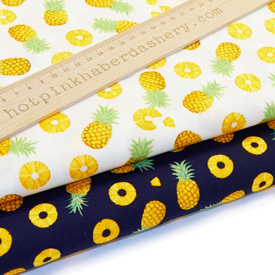 Playful pineapple fruit print 100% cotton poplin fabric by Rose and Hubble in Ivory and Navy blue