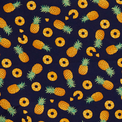 Swatch of playful pineapple fruit print 100% cotton poplin fabric by Rose and Hubble in Navy blue