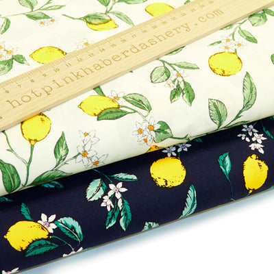 Illustrated lemon, leaves and flower print 100% cotton poplin fabric by Rose and Hubble in Navy blue and ivory